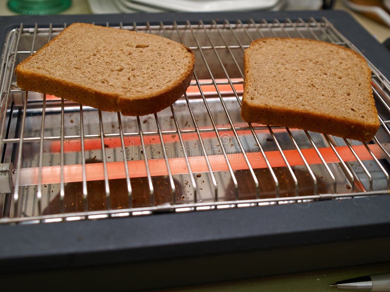 Slices of bread toasted on a flat toaster