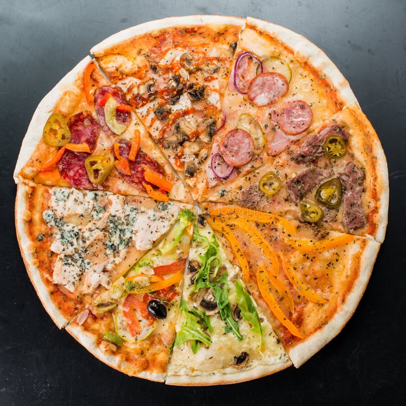 Slices of different pizzas collected in one pizza on a dark back stock image Slices of different pizzas collected in one pizza on a dark back stock image