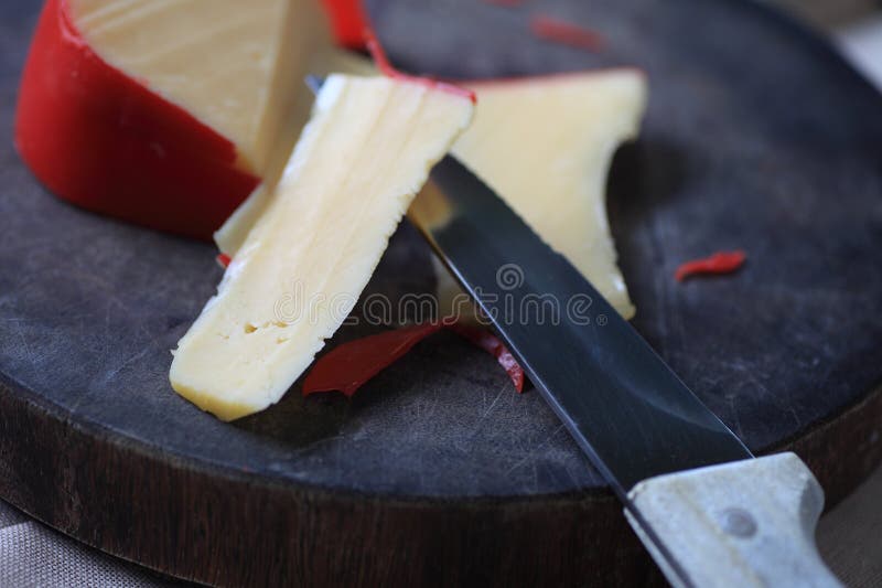 Slices of Gouda Cheese on Cutting Board Stock Image Image of cheese