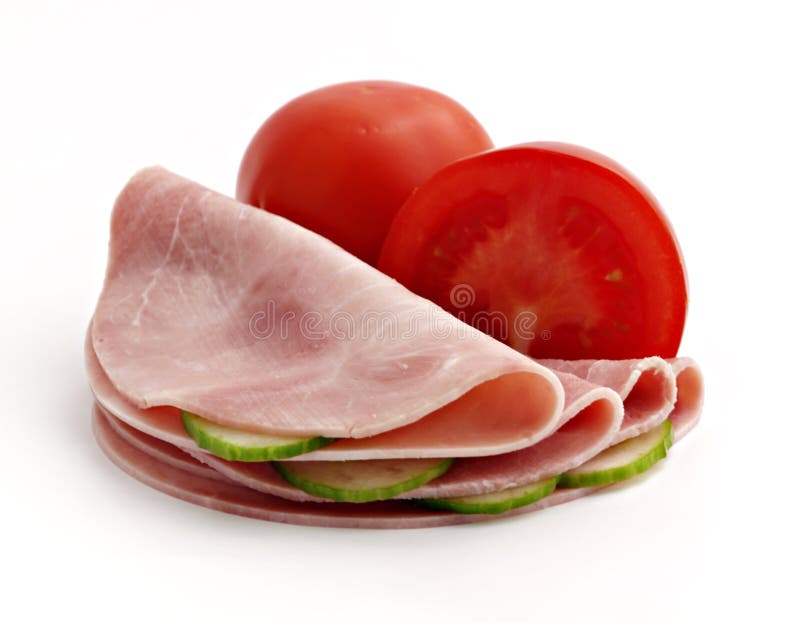 Slices of ham with cucumber and tomato