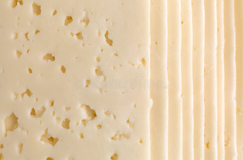 Slices of Havarti cheese close view stock images