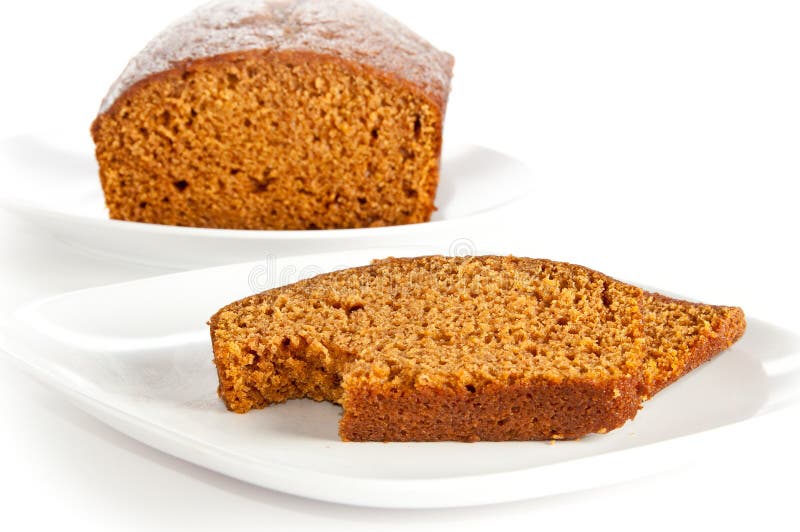 Slices and loaf of freshly baked pumpkin bread. Slices and loaf of freshly homemade pumpkin bread on white, isolating background royalty free stock image Slices and loaf of freshly baked pumpkin bread. Slices and loaf of freshly homemade pumpkin bread on white, isolating background royalty free stock image