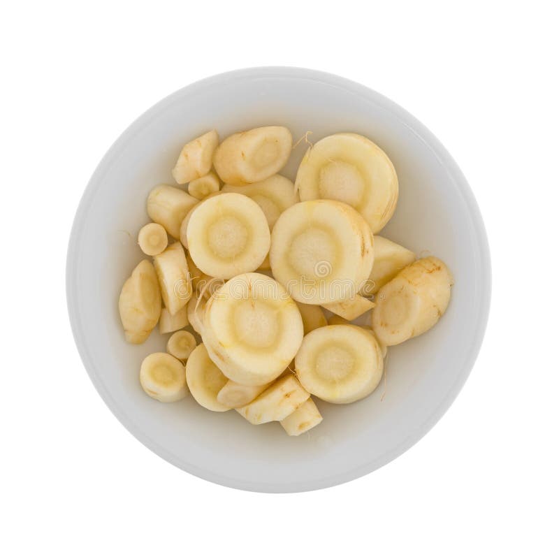 Slices of parsnip in a bowl stock photography