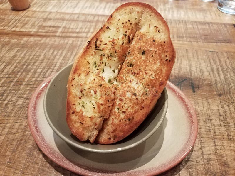 Slices of Seasoned Garlic Bread in a Bowl Stock Photo Image of table