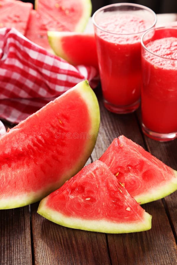 Slices of watermelon on brown wooden background stock image Slices of watermelon on brown wooden background stock image
