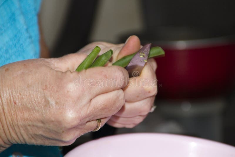 Slicing fresh Green Stick Beans royalty free stock photography