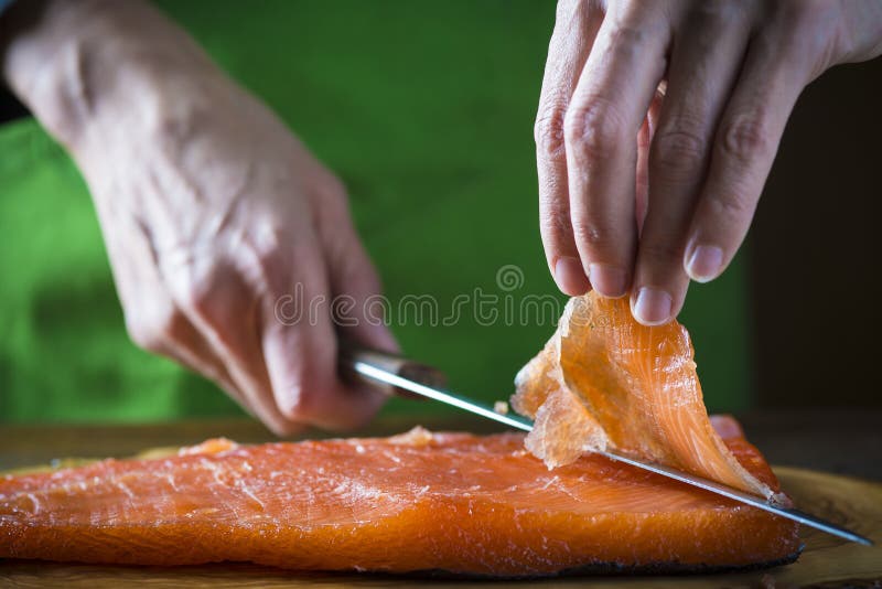 Slicing Gravlax Salmon with a Knife Stock Photo Image of working