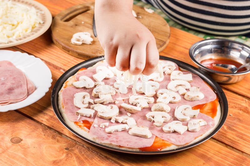 Slicing Mushrooms and Preparing Ingredients for Baking Pizza Stock