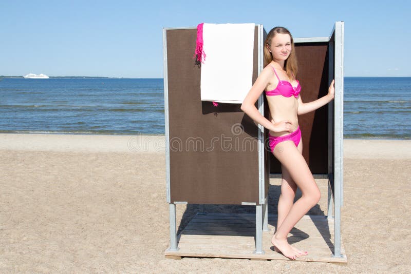 Beautifull girl changing on beach