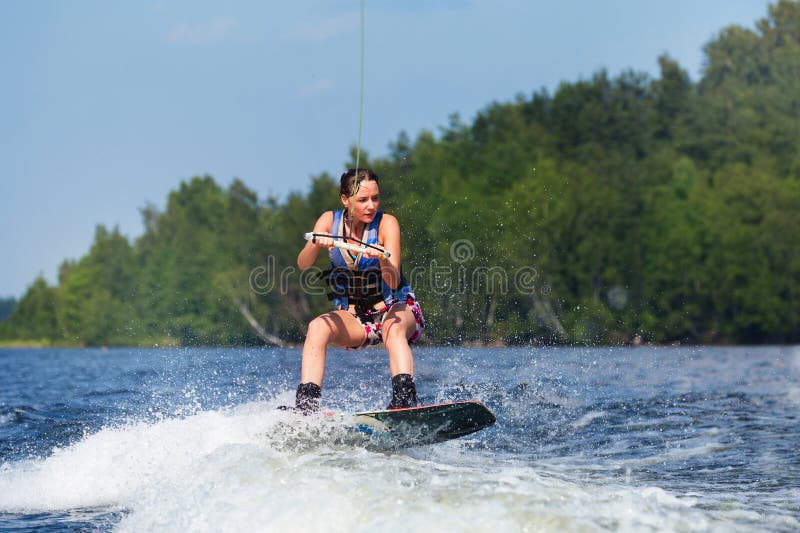 Slim Brunette Woman Riding Wakeboard On Lake Stock Image Image Of 