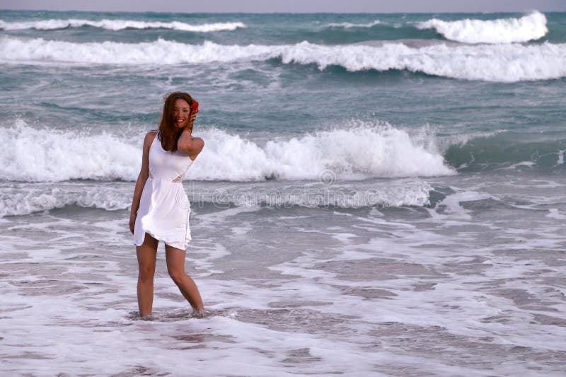 Smiling girl near the ocean