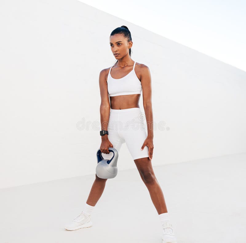 Full-length slim fit female in white sports attire. Woman standing on white  stairs relaxing during training stock photo (272517) - YouWorkForThem