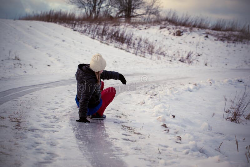 Slip on the slippery ice and snow on the road track at the country in freezing winter day