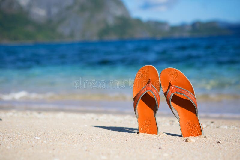 Slippers on sand beach stock image. Image of perfect - 31596923
