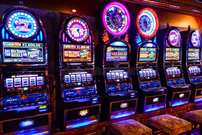 Row of Colorful Slot Machines Lit Up at a Casino Editorial Photography -  Image of glowing, light: 144520692