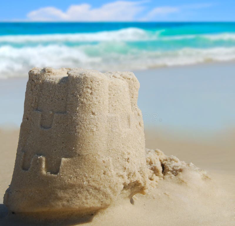 Pretty sand castle with ocean in distance. Pretty sand castle with ocean in distance
