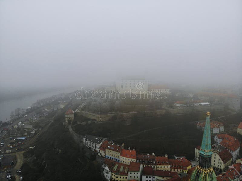 Slovakia, Bratislava. Historical centre. Aerial view from above, created by drone. Foggy day town landscape, travel photography.