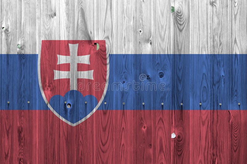Slovakia flag depicted in bright paint colors on old wooden wall. Textured banner on rough background