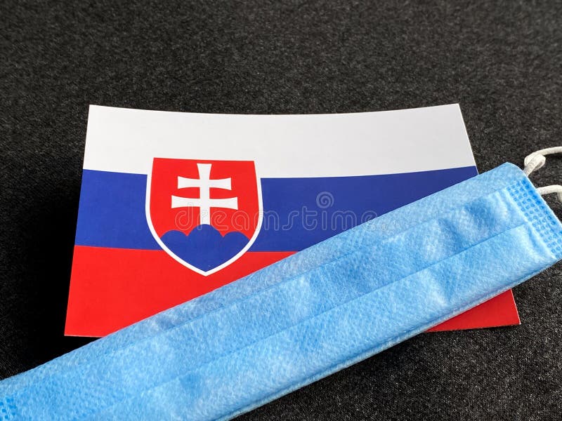 Slovakia, Slovak flag is near a blue mask on the dark gray background. Tourist trip. European Football Championship