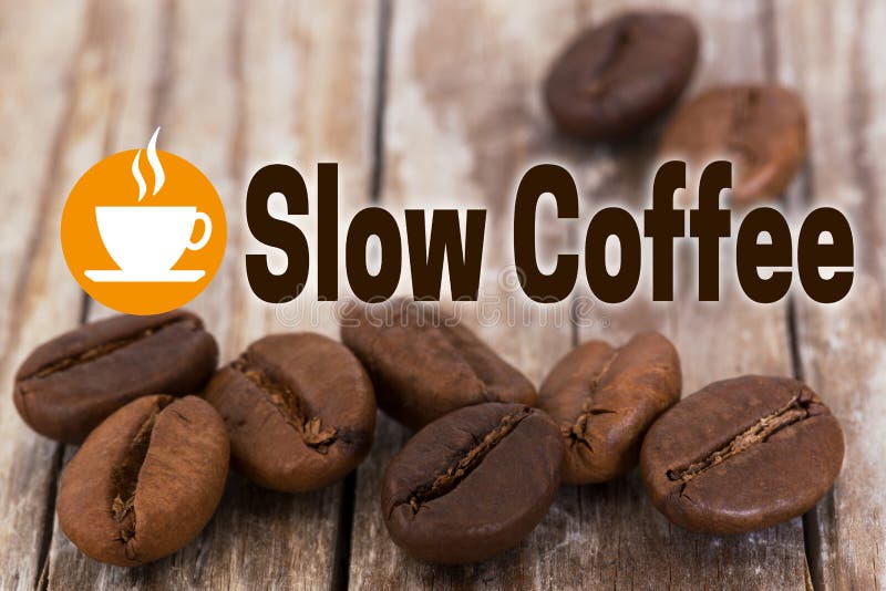 Slow Coffee Concept Background with coffee beans and wood