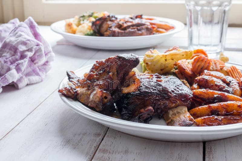 Slow cooked ribs with homemade pasta and grilled vegetables royalty free stock image Slow cooked ribs with homemade pasta and grilled vegetables royalty free stock image