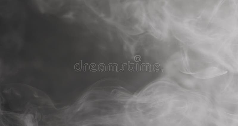 Slow motion closeup vapor floating in air on black background