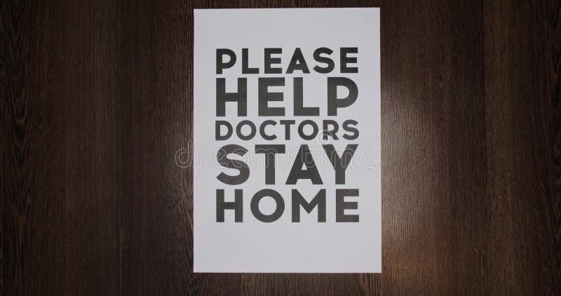 Slow motion, decrease the poster with the inscription, please help doctors, stay home. Concept poster with the inscription stay at home, slow-mo. Decrease video