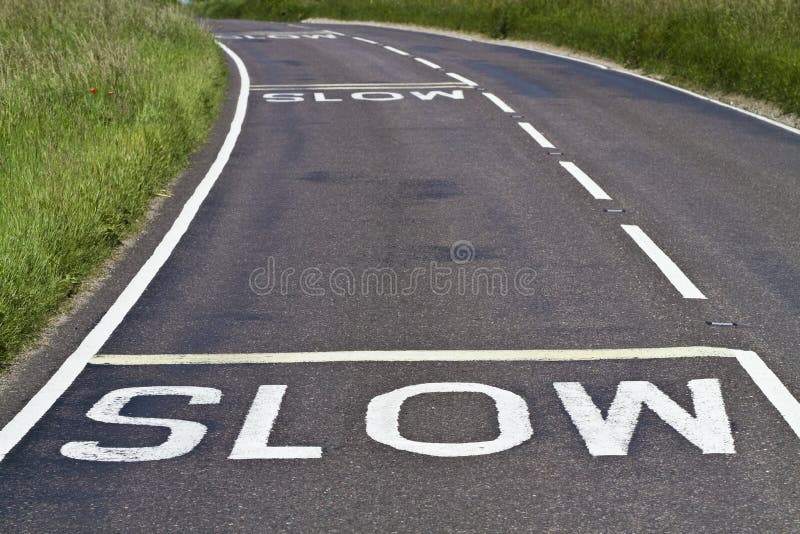 Slow signs on the road royalty free stock image