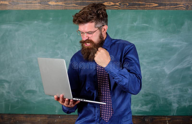 Slowly internet annoying him. Annoyed by slow internet. Hipster teacher aggressive with laptop goes mad about slow speed.