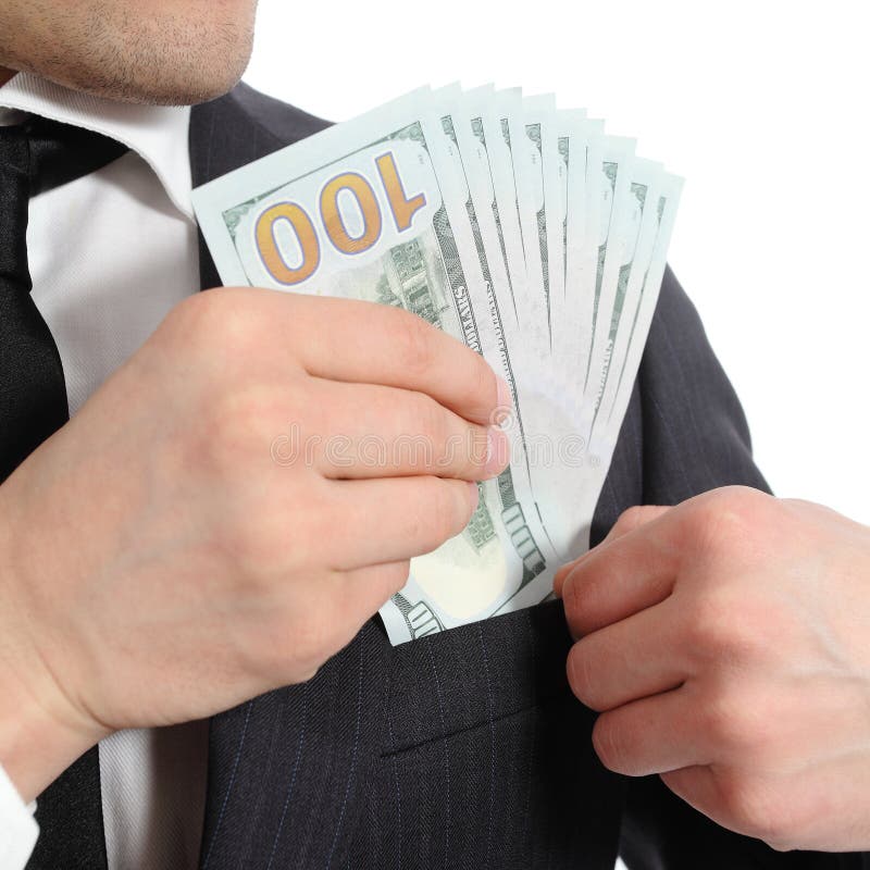 Close up of a business man hand keeping money in his pocket isolated on a white background. Close up of a business man hand keeping money in his pocket isolated on a white background