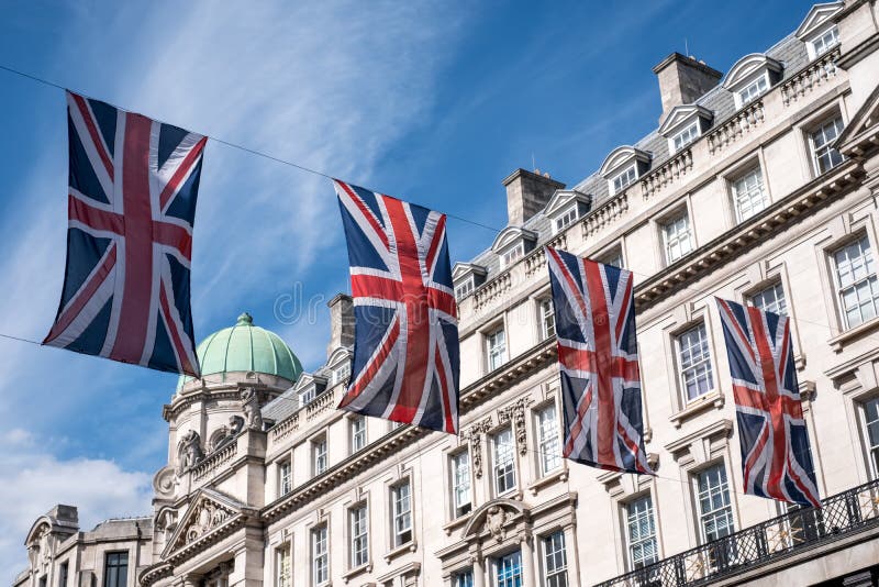 London UK. Close up of building on Regent Street photographed from street level, with row of British flags to celebrate the Royal Wedding of Prince Harry to Meghan Markle. Photographed on a sunny day. London UK. Close up of building on Regent Street photographed from street level, with row of British flags to celebrate the Royal Wedding of Prince Harry to Meghan Markle. Photographed on a sunny day.