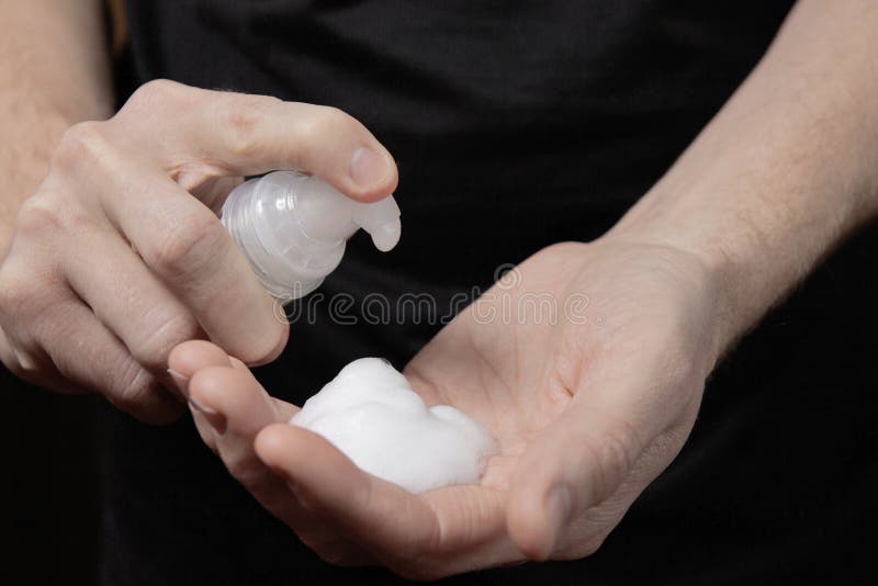 Closeup of a male hand with foam on the palm. man squeezes shaving foam onto his hand. Putting whip foam soap bottle with foam on man hand, shave, cream, lotion, dispenser, pump, antibacterial, sanitizer, disinfectant, gel, beauty, skin, face, hygiene, wash, liquid, mild, care, scented, arm, background, bathroom, body, container, cosmetic, design, droplet, finger, health, holding, horizontal, moisturizer, object, package, photo, photography, plastic, portable, push, spa, sun, toiletries, white, guy. Closeup of a male hand with foam on the palm. man squeezes shaving foam onto his hand. Putting whip foam soap bottle with foam on man hand, shave, cream, lotion, dispenser, pump, antibacterial, sanitizer, disinfectant, gel, beauty, skin, face, hygiene, wash, liquid, mild, care, scented, arm, background, bathroom, body, container, cosmetic, design, droplet, finger, health, holding, horizontal, moisturizer, object, package, photo, photography, plastic, portable, push, spa, sun, toiletries, white, guy