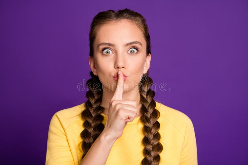 Closeup photo of amazing lady long braids holding finger lips afraid friend will tell handsome, guy her secret wear casual yellow jumper isolated purple color background. Closeup photo of amazing lady long braids holding finger lips afraid friend will tell handsome, guy her secret wear casual yellow jumper isolated purple color background