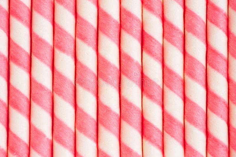 Sluiting van een roze gestreepte waferklep met textureerde achtergrond