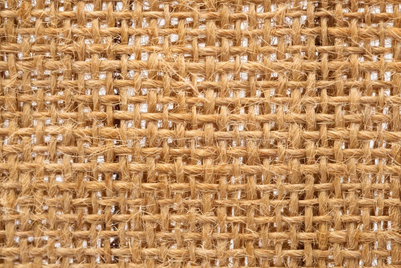 Slut upp textur för säckvävsäckvävtyg på vit bakgrund royaltyfri bild Slut upp textur för säckvävsäckvävtyg på vit bakgrund royaltyfri bild