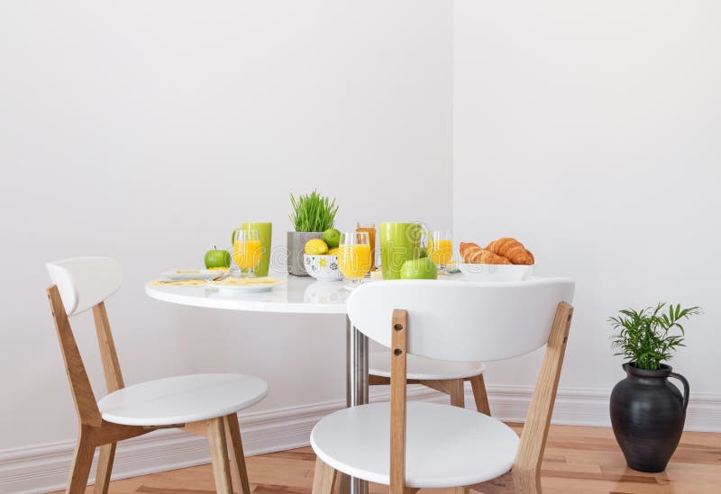 Tasty and healthy breakfast on a white round table. Tasty and healthy breakfast on a white round table.