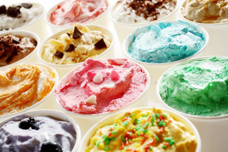 Display of tasty summer ice cream in different flavors and colors served in individual tubs viewed obliquely for advertising for a parlour or ice cream shop. Display of tasty summer ice cream in different flavors and colors served in individual tubs viewed obliquely for advertising for a parlour or ice cream shop