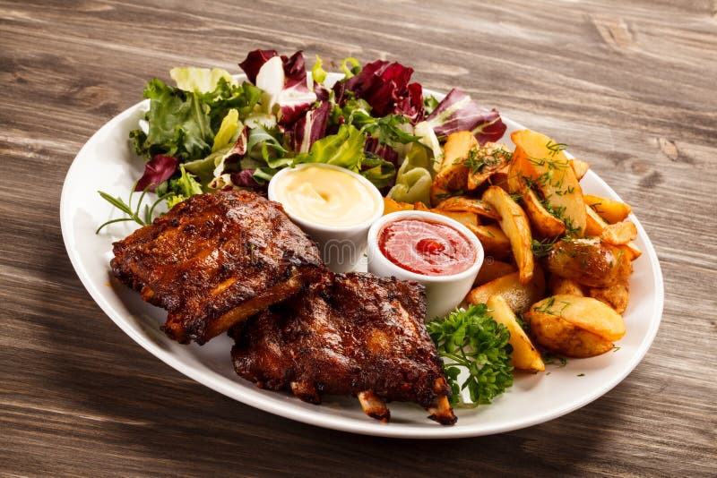 Tasty grilled ribs with vegetables. Tasty grilled ribs with vegetables