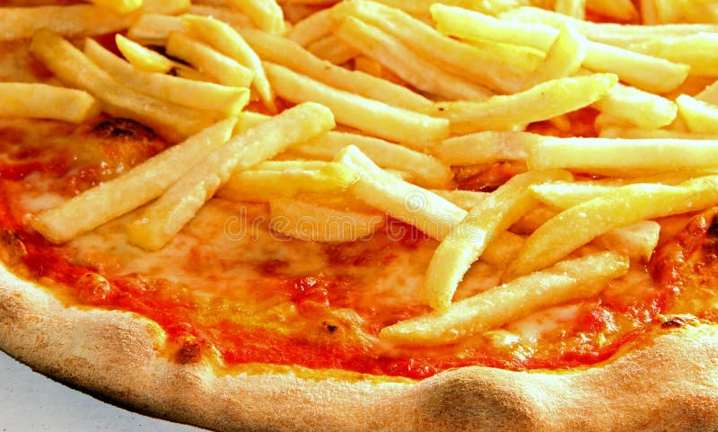 Tasty pizza with French fries and mozzarella and tomato cooked on oven pizzeria in italy. Tasty pizza with French fries and mozzarella and tomato cooked on oven pizzeria in italy