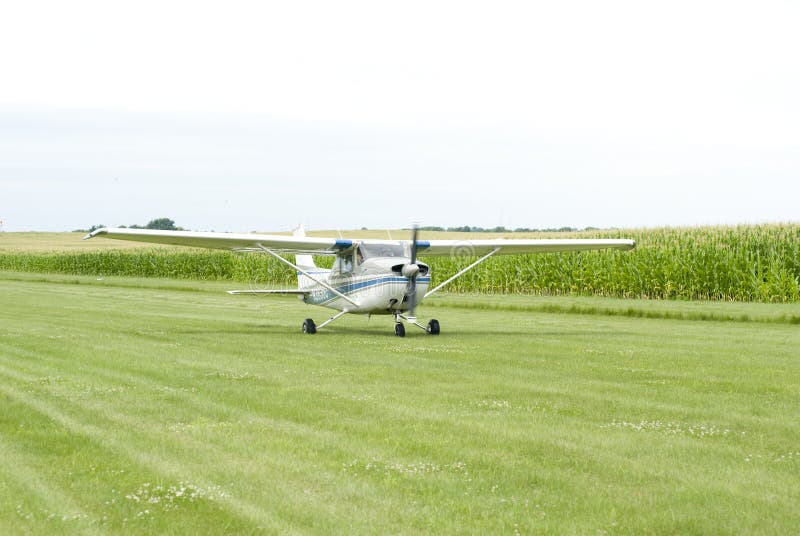 Small airplane on field