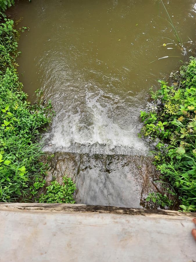 Small Amount of Force Water Flowing from Pond or Small Dam in the