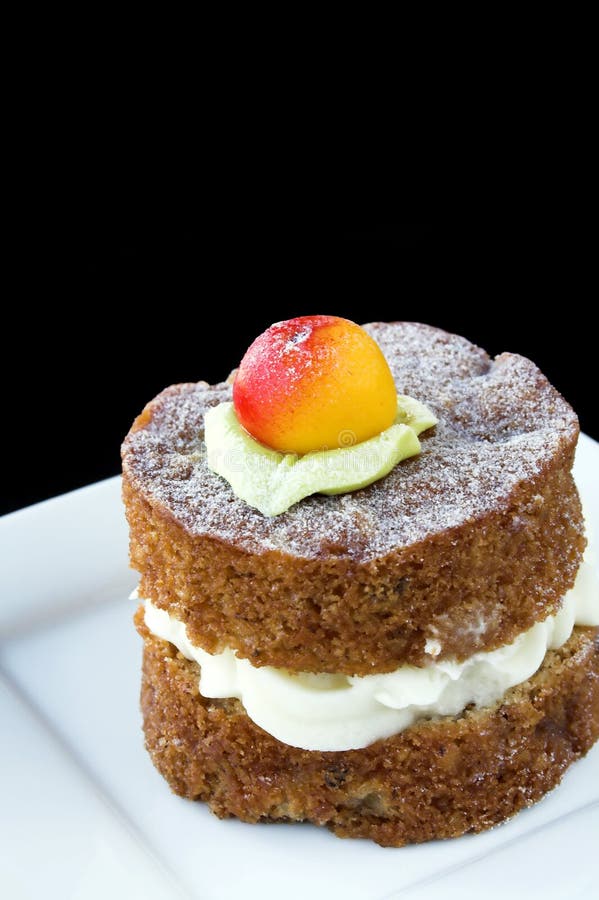 Small apple cake on white plate