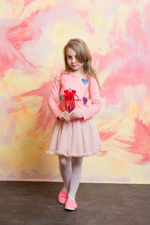 Small baby girl holding valentines day decorative red hearts stock images Small baby girl holding valentines day decorative red hearts stock images