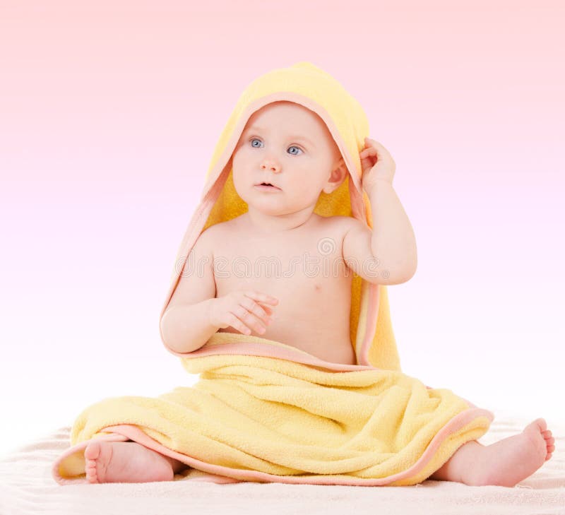 Small baby in yellow towel