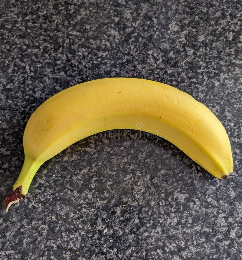Small banana on worktop stock photo. Image of snack 183946004