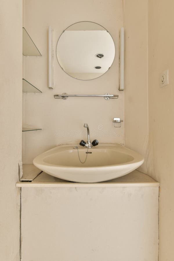 A Small Bathroom with a Sink and a Mirror Stock Photo Image of inside