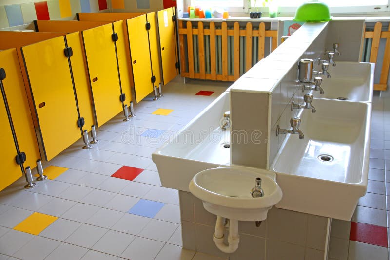 Small Bathrooms and Low Sinks in a School for Young Children Stock