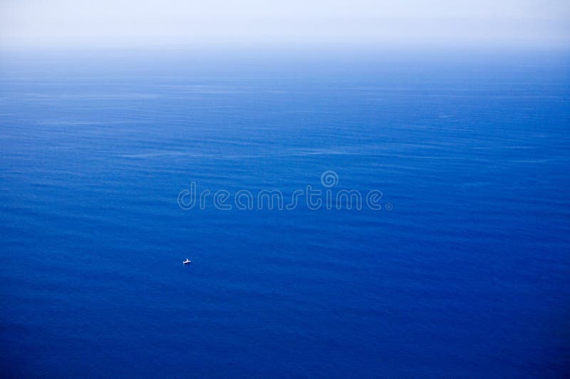 Small boat in great ocean