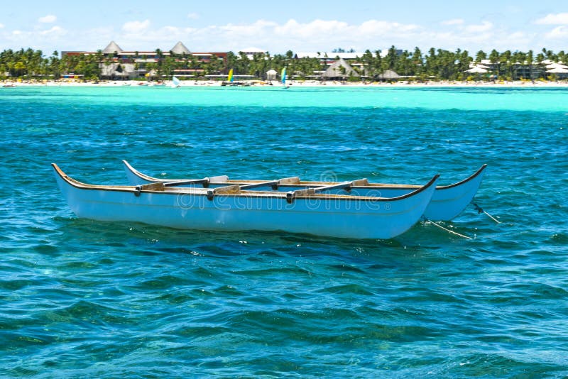 Small Boat Sailing on the Big Turquoise Ocean with Waves. Stock Photo