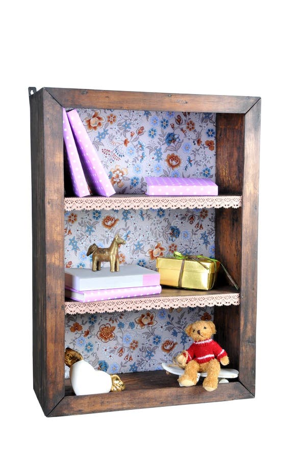 Small Bookshelf with Books and Cute Figurines Isolated on White Stock